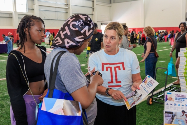 Members of our Temple Health team (including Hanson, above) provide safe sleep education before community members receive their free portable bassinets.