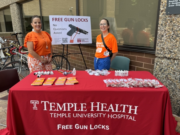 Annette Prado, MSN, RN-BC, Associate Director of Nursing Services, and anti-gun violence rally organizer Natalie Chamberlain staff the table in front of TUH-Main Campus.