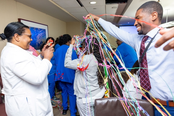 Nursing team members enjoy playing around with streamers.