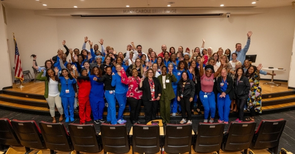 Attendees take a celebratory photo in the Erny Auditorium at TUH-Main Campus.