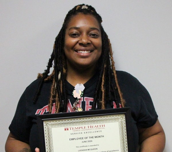 McQueen with her Service Excellence Employee of the Month Award.