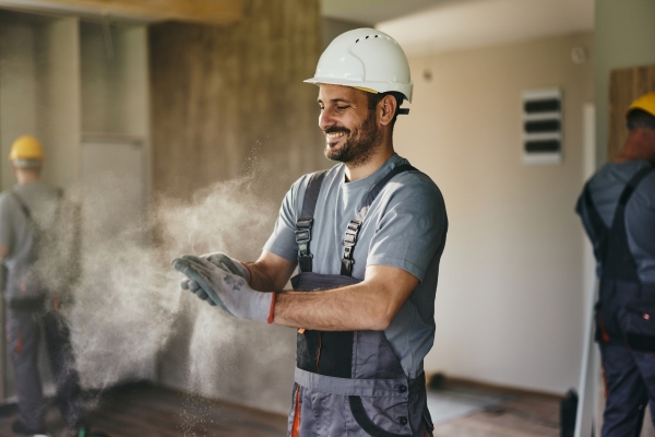 A man with a hard hat on at work