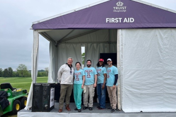 Temple Health team members at the Truist Championship, including Temple Health-Chestnut Hill President & CEO Richard Newell (far left).