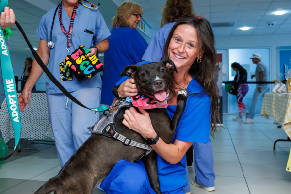 A Temple Health team member with a new furry friend at this year’s Dog Days of Summer event.