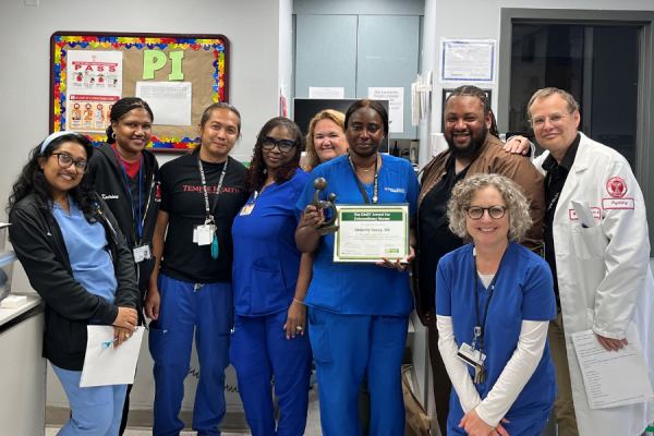 Mabinty Sesay, RN (center right) celebrates her DAISY Award with her colleagues.