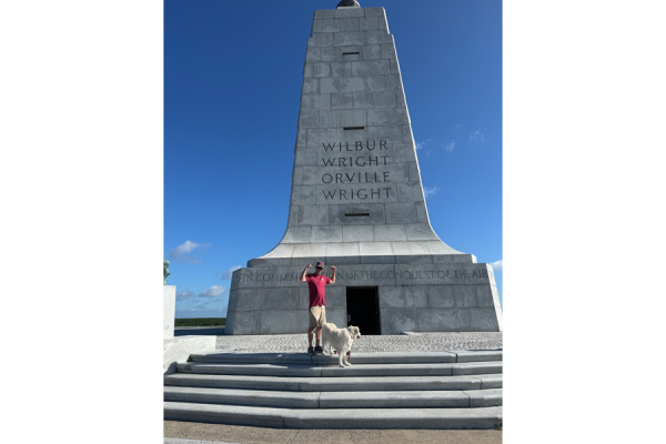 John and his dogs at the top of Wright Brothers National Memorial.