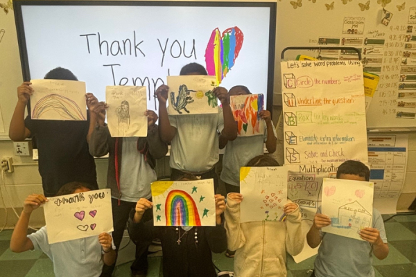 Third graders at Julia de Burgos Elementary School hold up their ‘Thank You Temple’ signs.