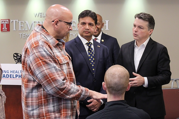 Rep. Boyle and Abhi Rastogi speak with TUH Trauma Outreach Manager Scott Charles (left).