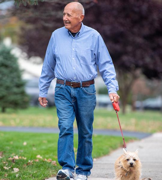 Heart transplant patient, Heinz, walking his dog