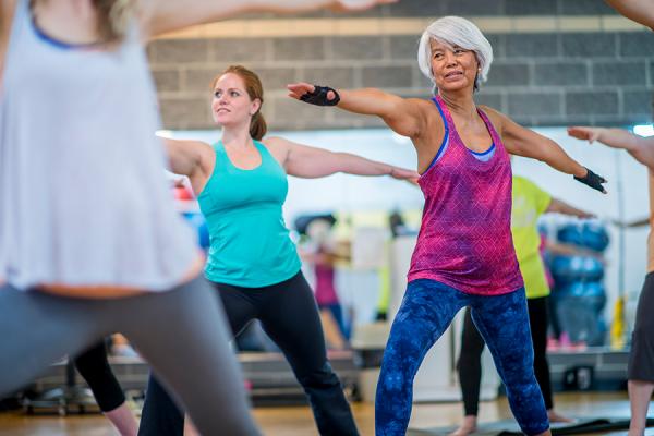 Women balancing in a yoga class